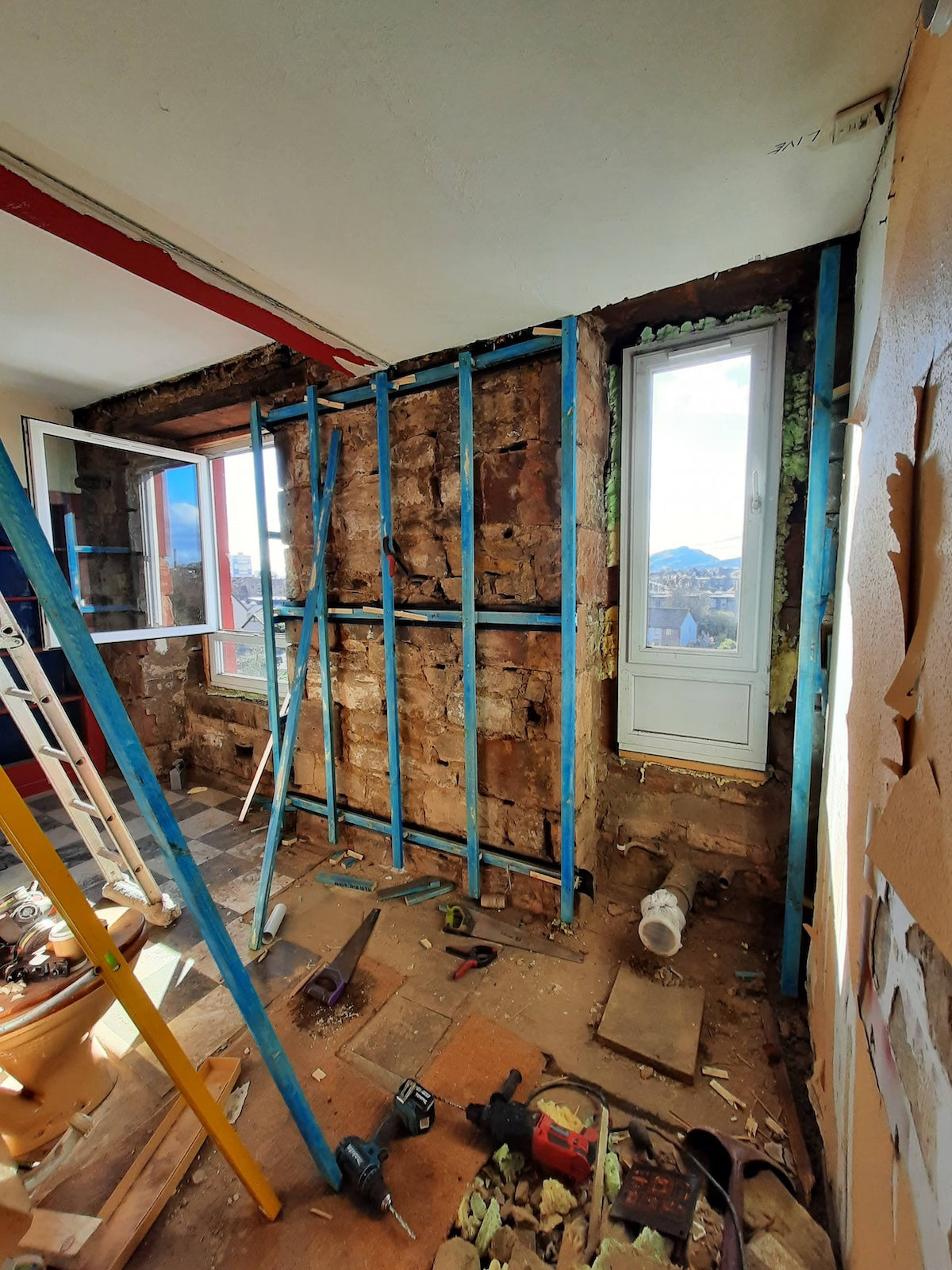 Structural Alteration work showing exposed steel beams and timber bracing during an Edinburgh flat renovation
